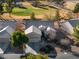 A close aerial view of a beige single-story home with an attached garage and desert landscaping at 7505 Chaffinch St, North Las Vegas, NV 89084