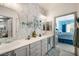 Bathroom featuring double sinks and views into the bedroom at 7505 Chaffinch St, North Las Vegas, NV 89084