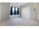 Simple bedroom with a neutral color palette and a closet at 7505 Chaffinch St, North Las Vegas, NV 89084