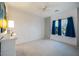 Bright bedroom featuring a ceiling fan and large window at 7505 Chaffinch St, North Las Vegas, NV 89084