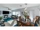 Cozy living room and dining area combination with plenty of natural light and stylish decor at 7505 Chaffinch St, North Las Vegas, NV 89084