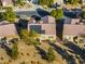 Aerial view of the home's rear exterior featuring solar panels, patio, and low-maintenance desert landscaping at 7505 Chaffinch St, North Las Vegas, NV 89084