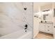 Contemporary bathroom featuring modern tile work, a soaking tub, and a stylish vanity with sleek hardware at 767 Durgos Dr, Henderson, NV 89012