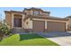 Attractive home featuring a double-door entry, three-car garage, and red tile roof at 767 Durgos Dr, Henderson, NV 89012