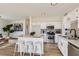 A kitchen featuring white cabinets, stainless steel appliances, and a breakfast bar at 767 Durgos Dr, Henderson, NV 89012