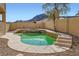 Inviting pool and spa area features custom steps, desert landscaping and privacy walls at 767 Durgos Dr, Henderson, NV 89012