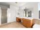 Bathroom featuring dual sinks, ample counter space, and a separate shower stall at 7840 Red Leaf Dr, Las Vegas, NV 89131