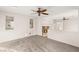 Upstairs bedroom with neutral carpet, bright windows, and a decorative fireplace at 7840 Red Leaf Dr, Las Vegas, NV 89131