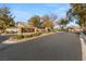 Gated community entrance with manicured landscaping and signage for a secure and welcoming entry at 7840 Red Leaf Dr, Las Vegas, NV 89131