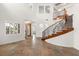 Spacious entryway featuring tile floors, high ceilings, and a winding staircase at 7840 Red Leaf Dr, Las Vegas, NV 89131