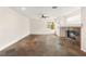 Open living room with slate tile fireplace and bright windows at 7840 Red Leaf Dr, Las Vegas, NV 89131