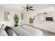 Staged primary bedroom showcasing a cozy fireplace, bright windows and comfortable carpet at 7840 Red Leaf Dr, Las Vegas, NV 89131