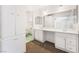 Bright bathroom featuring dual sinks, ample storage and a large mirror at 845 Palo Verde Dr, Henderson, NV 89015