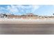 Single story house with a charming white fence and a backdrop of clear blue sky at 845 Palo Verde Dr, Henderson, NV 89015