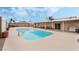 Beautiful pool with a tanning ledge and covered outdoor area at 845 Palo Verde Dr, Henderson, NV 89015