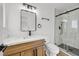 Modern bathroom with a new vanity, marble countertop, and a glass-enclosed shower at 865 Armada Pl, Boulder City, NV 89005