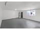 Spacious garage with concrete floor, garage door, window, and door to the outside at 865 Armada Pl, Boulder City, NV 89005