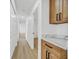 Hallway area featuring light hardwood floors, ample storage, and marble countertop at 865 Armada Pl, Boulder City, NV 89005