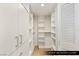 The guest bedroom closet boasts custom white shelving and storage solutions at 9101 Alta Dr # 103, Las Vegas, NV 89145