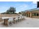 Outdoor patio featuring a stone bar with seating and an outbuilding at 9101 Alta Dr # 103, Las Vegas, NV 89145