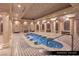 Womens' Jacuzzi room featuring Romanesque columns, decorative lighting and tile, and spa seating at 9101 Alta Dr # 103, Las Vegas, NV 89145