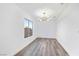 Minimalist dining area with modern chandelier and bright natural light at 9541 Summersweet Ct, Las Vegas, NV 89123