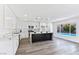 Well-lit kitchen showcasing a large center island, stainless steel appliances, and a pool view at 9541 Summersweet Ct, Las Vegas, NV 89123