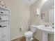 Bathroom featuring a pedestal sink, tile flooring and a decorative mirror at 9734 Cluny Ave, Las Vegas, NV 89178