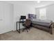 Neutral bedroom featuring a large window, carpet flooring, and a wooden bed frame at 9734 Cluny Ave, Las Vegas, NV 89178