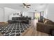 Spacious living room showcasing hardwood floors and a modern decor at 9734 Cluny Ave, Las Vegas, NV 89178