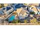 Aerial view of neighborhood showcasing a home with a pool and a well-maintained landscape at 1 Rising Sun Ct, Henderson, NV 89074