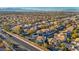 Expansive aerial view of a residential neighborhood, offering a glimpse of community living with city views at 1 Rising Sun Ct, Henderson, NV 89074