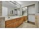 Spacious bathroom featuring double vanity and a large mirror at 1 Rising Sun Ct, Henderson, NV 89074