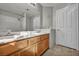 Bathroom featuring a double sink vanity with a large mirror at 1 Rising Sun Ct, Henderson, NV 89074