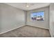 Neutral bedroom with a ceiling fan and a sunny window at 1 Rising Sun Ct, Henderson, NV 89074