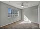 A sunny bedroom offers natural light through a large window at 1 Rising Sun Ct, Henderson, NV 89074