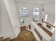 Foyer with high ceilings, arched windows, and staircase at 1 Rising Sun Ct, Henderson, NV 89074