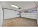 Spacious garage with brick flooring and ample storage cabinets at 1 Rising Sun Ct, Henderson, NV 89074