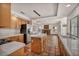 Bright kitchen featuring wooden cabinets, stainless steel appliances, and an open layout into the living area at 1 Rising Sun Ct, Henderson, NV 89074