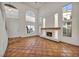 Inviting living room featuring a tiled fireplace, neutral decor, and multiple windows for a bright, airy feel at 1 Rising Sun Ct, Henderson, NV 89074
