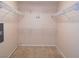 Walk-in closet features carpet and plenty of shelving at 10773 Wildhurst St, Las Vegas, NV 89183