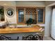 Close-up of a bar area featuring a granite countertop, a built-in sink and beverage storage at 11118 Scotscraig Ct, Las Vegas, NV 89141