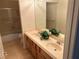 Bright bathroom featuring a bathtub and double sinks with storage at 11118 Scotscraig Ct, Las Vegas, NV 89141