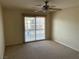 Bedroom with sliding glass doors and ceiling fan at 11118 Scotscraig Ct, Las Vegas, NV 89141