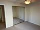Bedroom with mirrored closet doors, carpet flooring, and natural light at 11118 Scotscraig Ct, Las Vegas, NV 89141