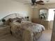 Bedroom featuring large bed with side tables and dresser at 11118 Scotscraig Ct, Las Vegas, NV 89141