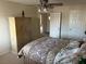 Bedroom with plush bedding and large armoire at 11118 Scotscraig Ct, Las Vegas, NV 89141