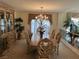 A dining room featuring an ornate wood table and chairs set under a decorative chandelier at 11118 Scotscraig Ct, Las Vegas, NV 89141