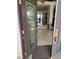 View from the open front door showing marble floors and an open concept living and dining area at 11118 Scotscraig Ct, Las Vegas, NV 89141