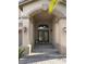 Front entrance with a double door, decorative lighting fixtures, and stone walkway at 11118 Scotscraig Ct, Las Vegas, NV 89141